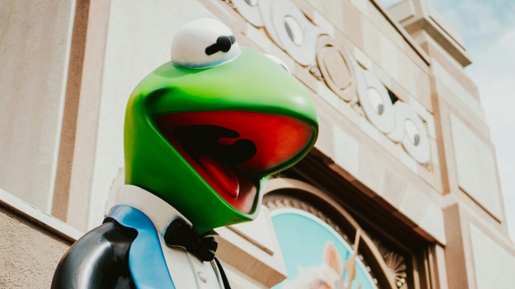 Close up of the Kermit statue outside the old Muppets store in Muppets Courtyard at Hollywood Studios