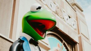 Close up of the Kermit statue outside the old Muppets store in Muppets Courtyard at Hollywood Studios